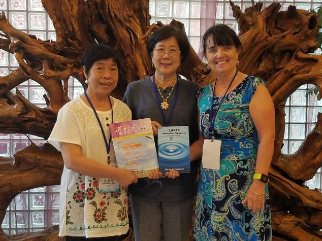 Group picture of editor, translator and author